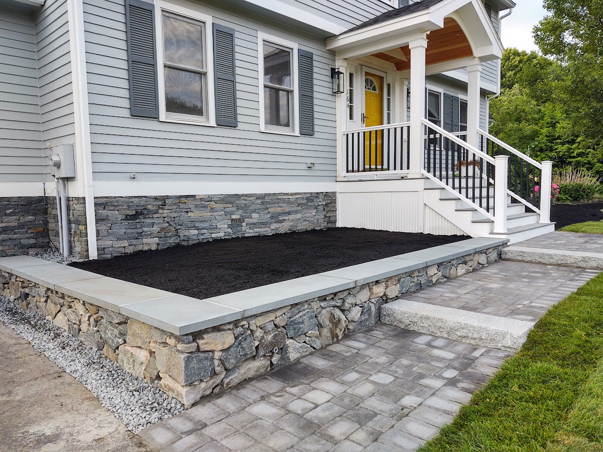 Stone and Paver Walkway and Stone Wall and Raised Bed